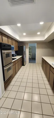 a view of a kitchen with electric appliances