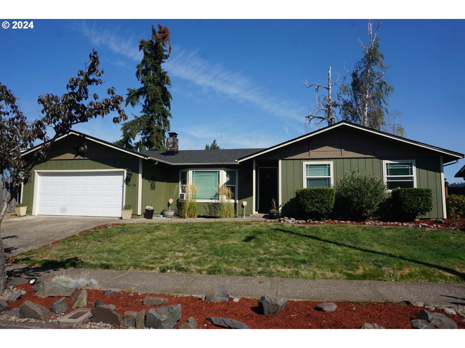 6976 B Street Springfield, OR 97478 - Photo 1 of 22 a front view of a house with a yard
