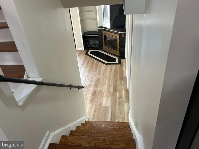 a view of a black door and furniture