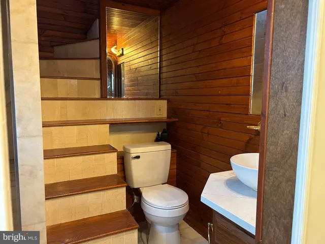 a bathroom with a glass door shower
