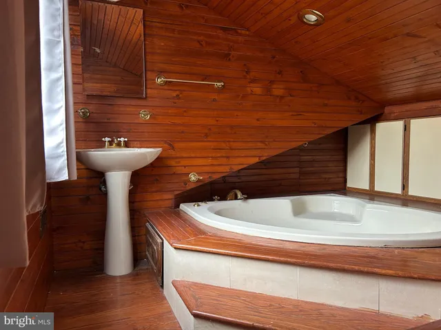 a bathroom with a sink and mirror