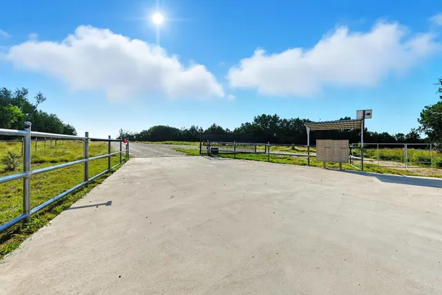 a view of swimming pool with a yard