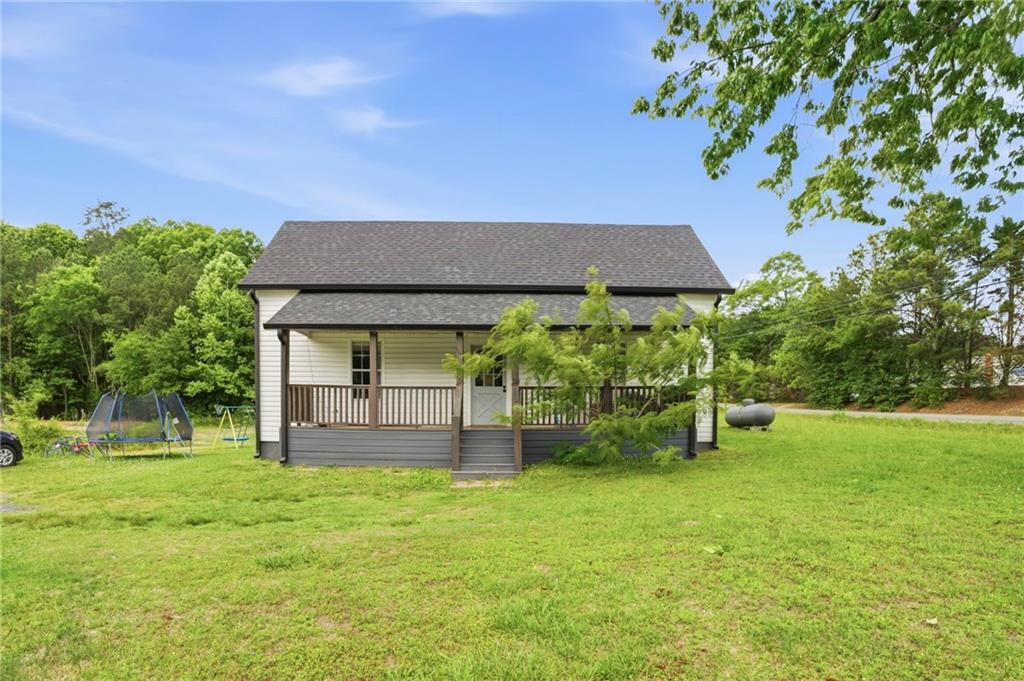 400 Sam Love Road Rocky Face, GA 30740 - Photo 2 of 29 a front view of a house with a yard