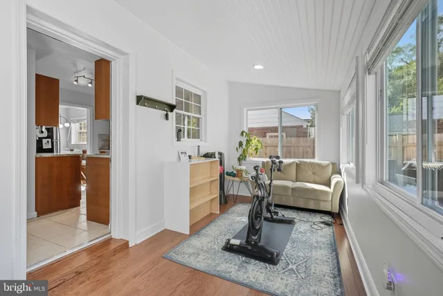 a living room with furniture windows and a table