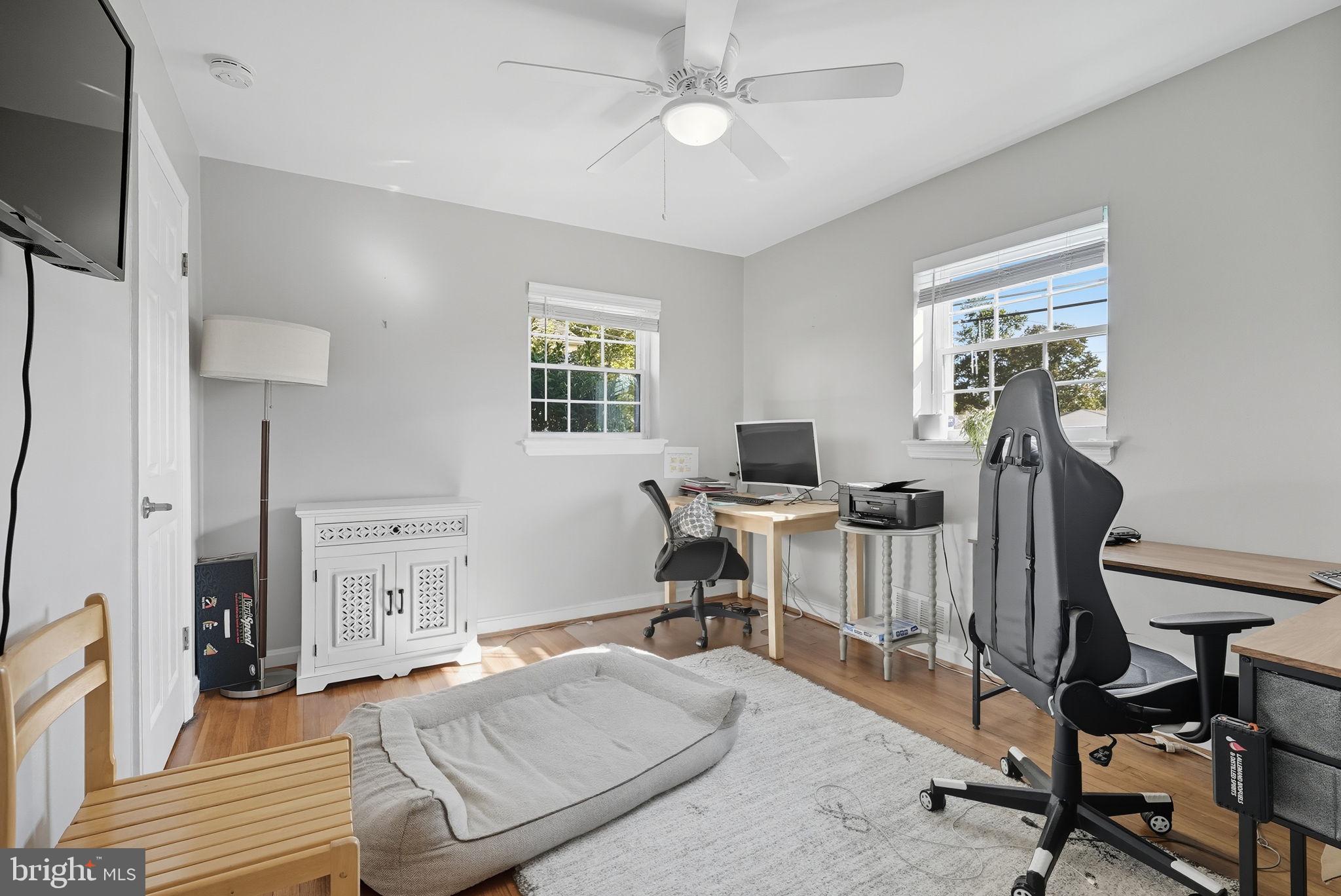 2632 North Sycamore Street Arlington, VA 22207 - Photo 17 of 26 a view of a workspace with furniture and a window