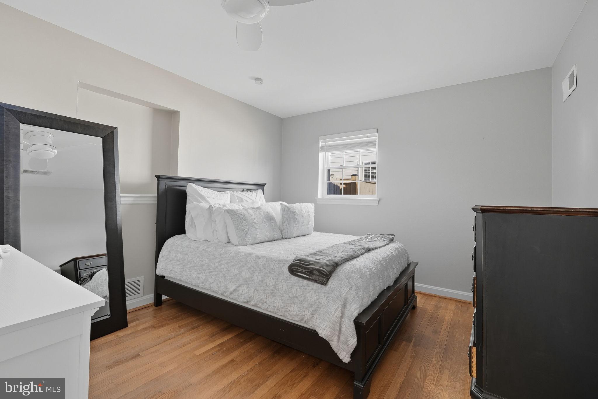 2632 North Sycamore Street Arlington, VA 22207 - Photo 18 of 26 a bedroom with a bed and window