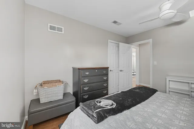 a bedroom with a bed and chair