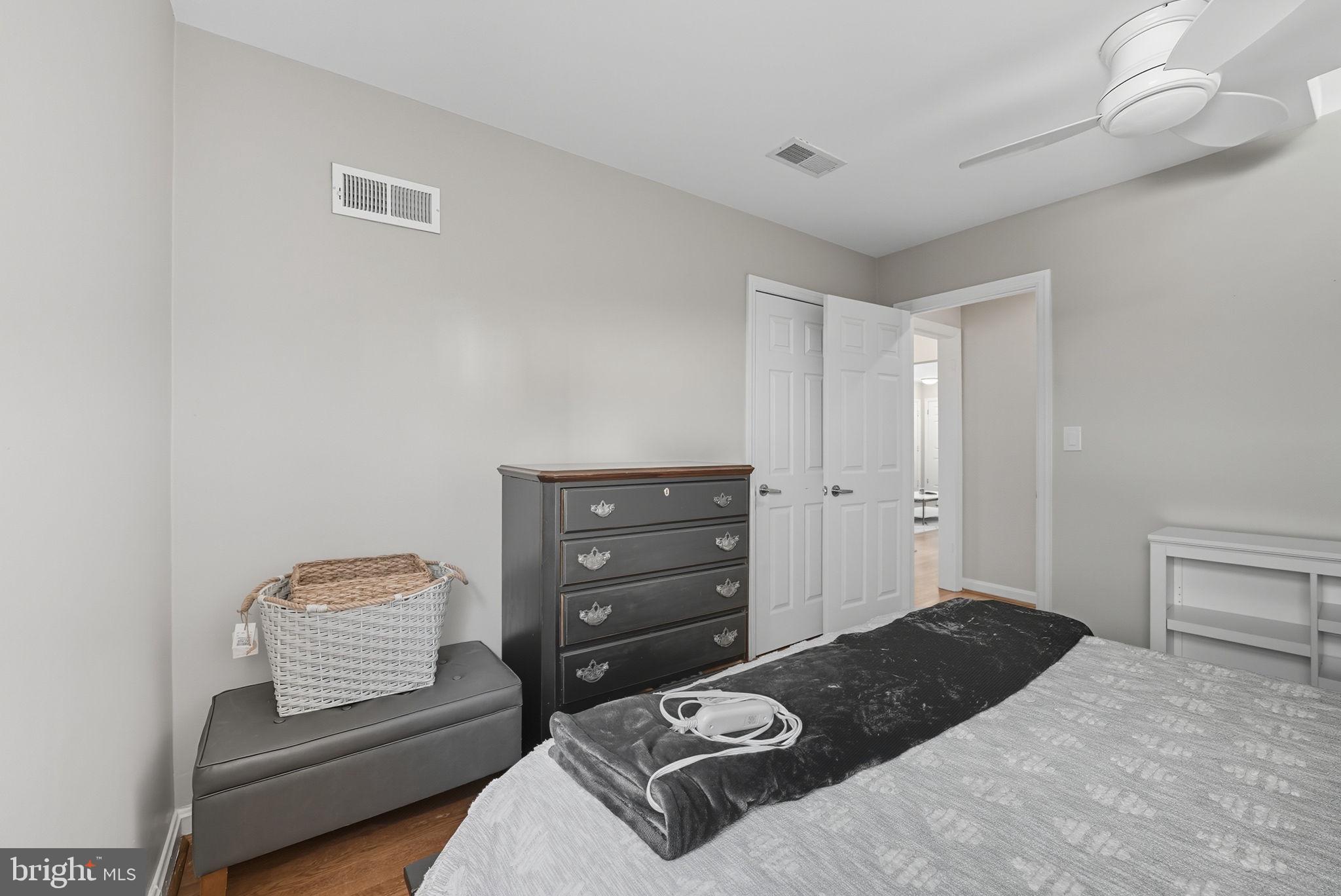 2632 North Sycamore Street Arlington, VA 22207 - Photo 19 of 26 a bedroom with a bed and chair