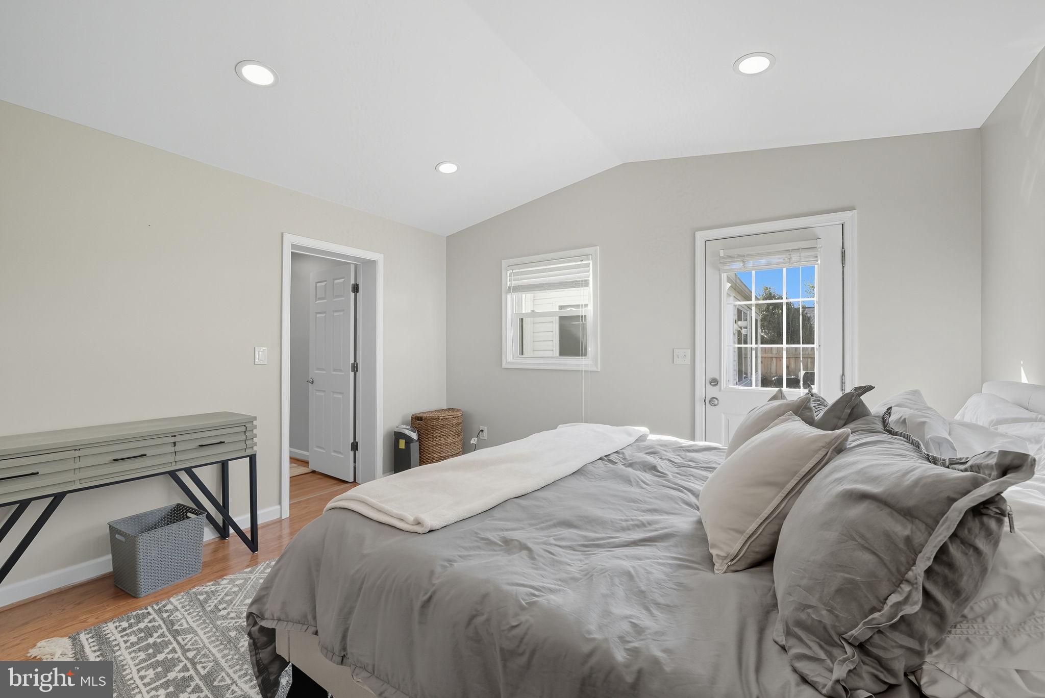 2632 North Sycamore Street Arlington, VA 22207 - Photo 20 of 26 a bed sitting in a bedroom next to a window