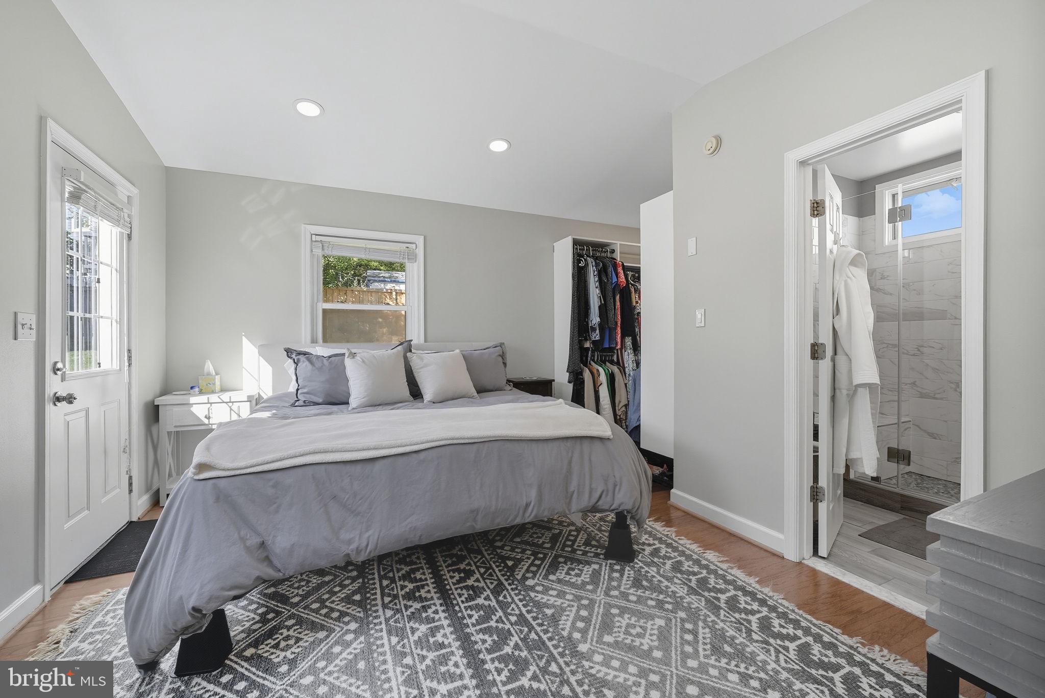 2632 North Sycamore Street Arlington, VA 22207 - Photo 21 of 26 a spacious bedroom with a bed and a rug