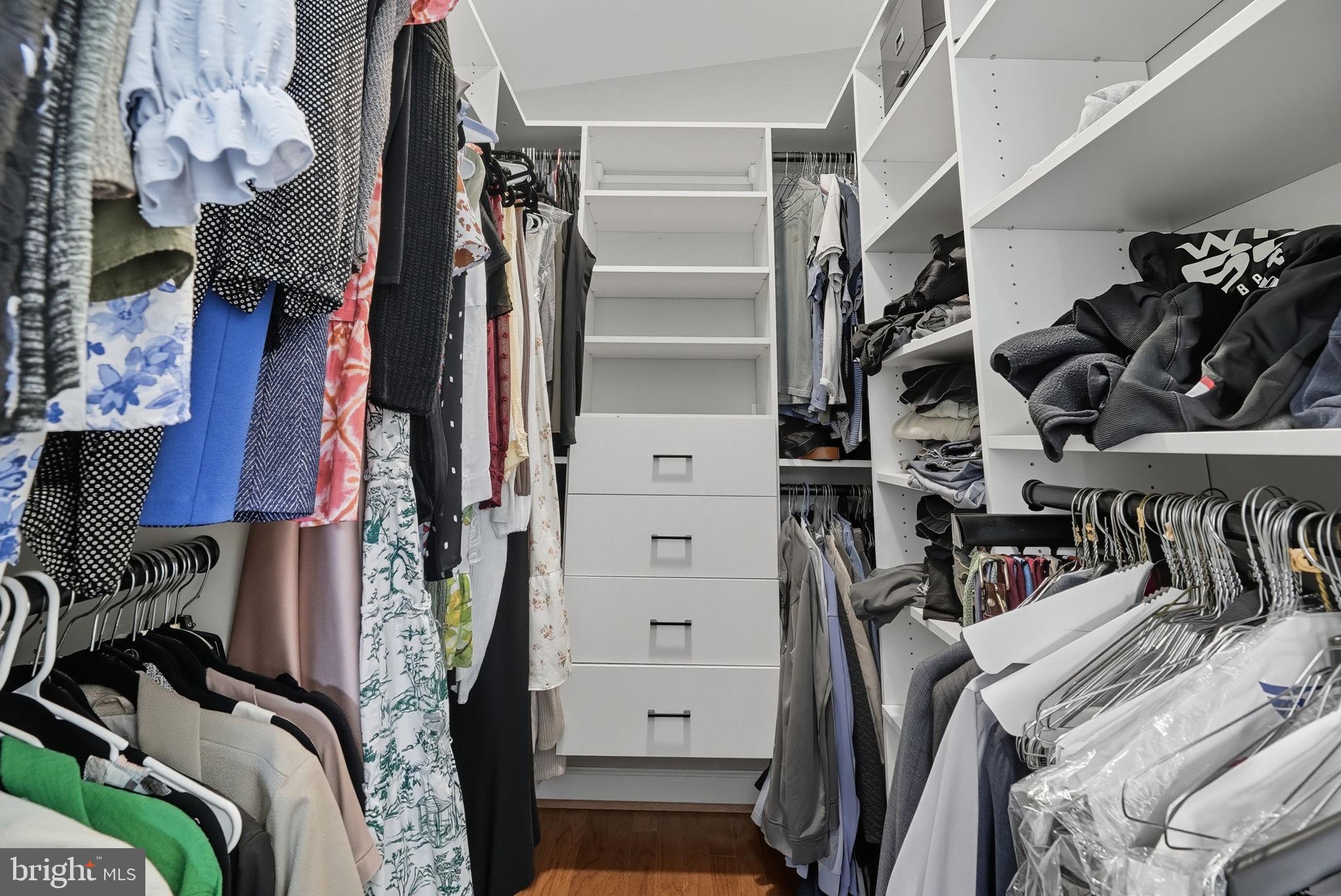 2632 North Sycamore Street Arlington, VA 22207 - Photo 22 of 26 a view of walk in closet with clothes and shoes