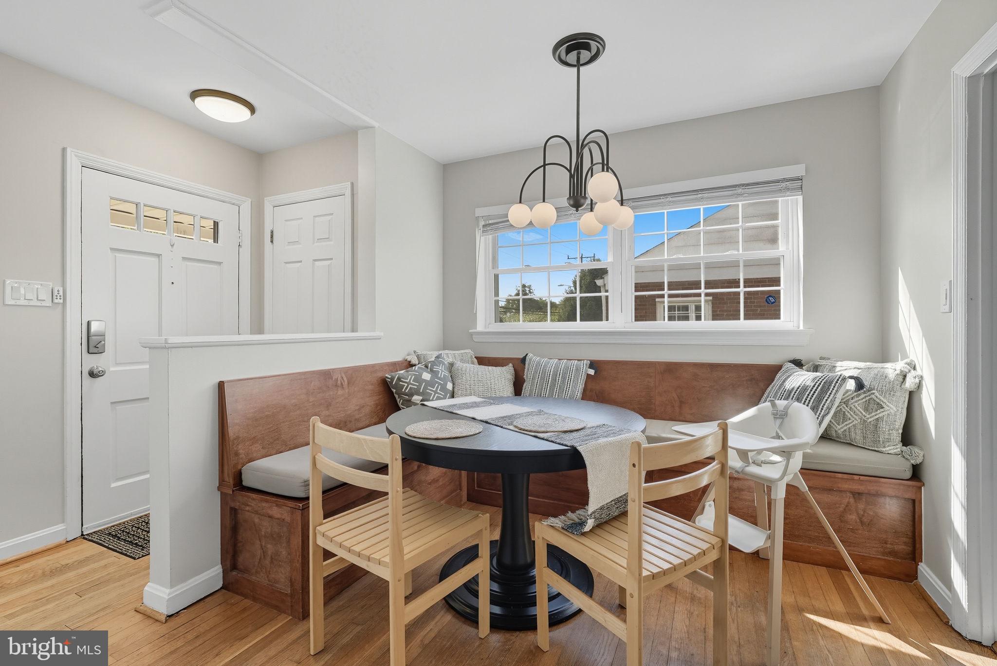 2632 North Sycamore Street Arlington, VA 22207 - Photo 5 of 26 a view of a dining room with furniture window and wooden floor