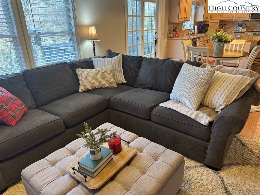 387 Tarry Acres Circle Blowing Rock, NC 28605 - Photo 16 of 41 a living room with furniture and a large window
