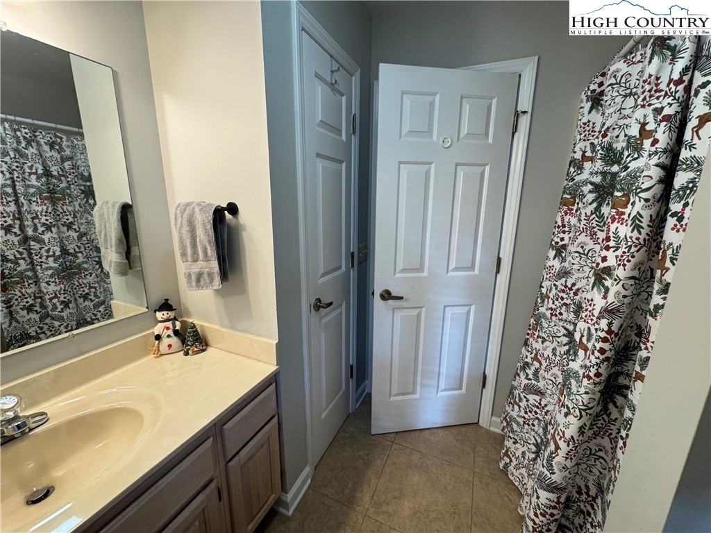 387 Tarry Acres Circle Blowing Rock, NC 28605 - Photo 20 of 41 a bathroom with a sink and a mirror