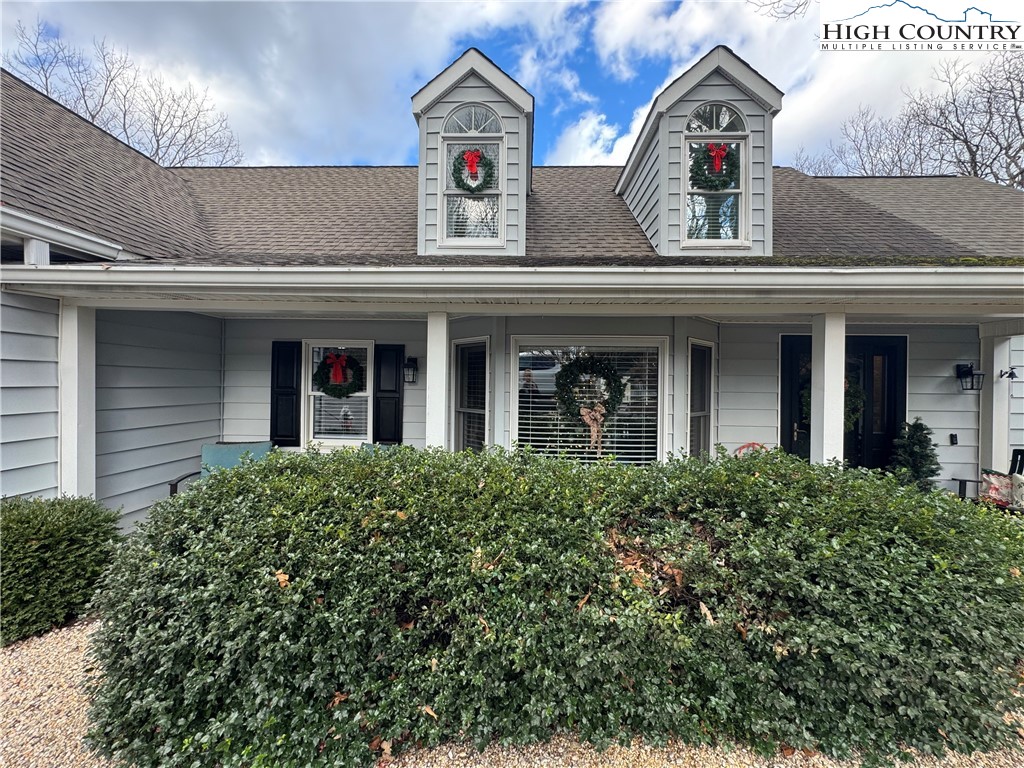 387 Tarry Acres Circle Blowing Rock, NC 28605 - Photo 2 of 41 a front view of a house with garage and plants