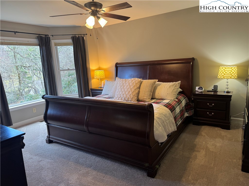 387 Tarry Acres Circle Blowing Rock, NC 28605 - Photo 22 of 41 a bedroom with a bed and window