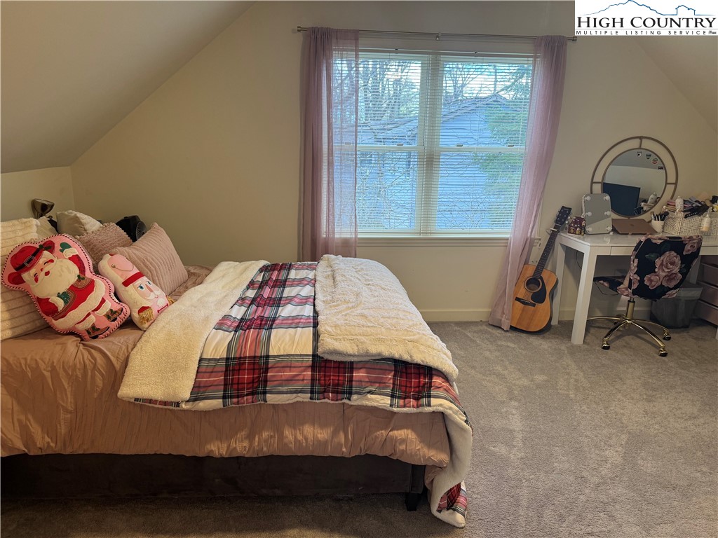 387 Tarry Acres Circle Blowing Rock, NC 28605 - Photo 26 of 41 a bedroom with a bed and a window