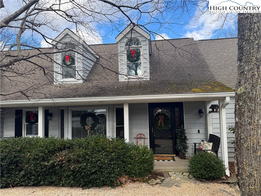 387 Tarry Acres Circle Blowing Rock, NC 28605 - Photo 3 of 41 a front view of white house