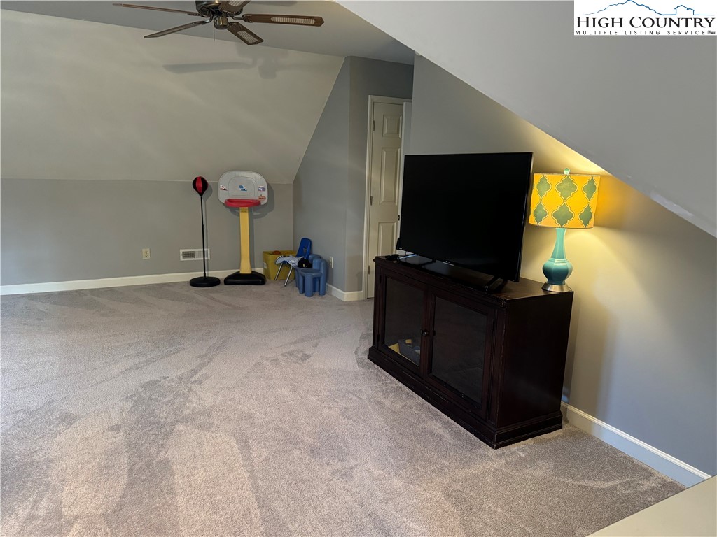 387 Tarry Acres Circle Blowing Rock, NC 28605 - Photo 33 of 41 a room with furniture and flat screen tv