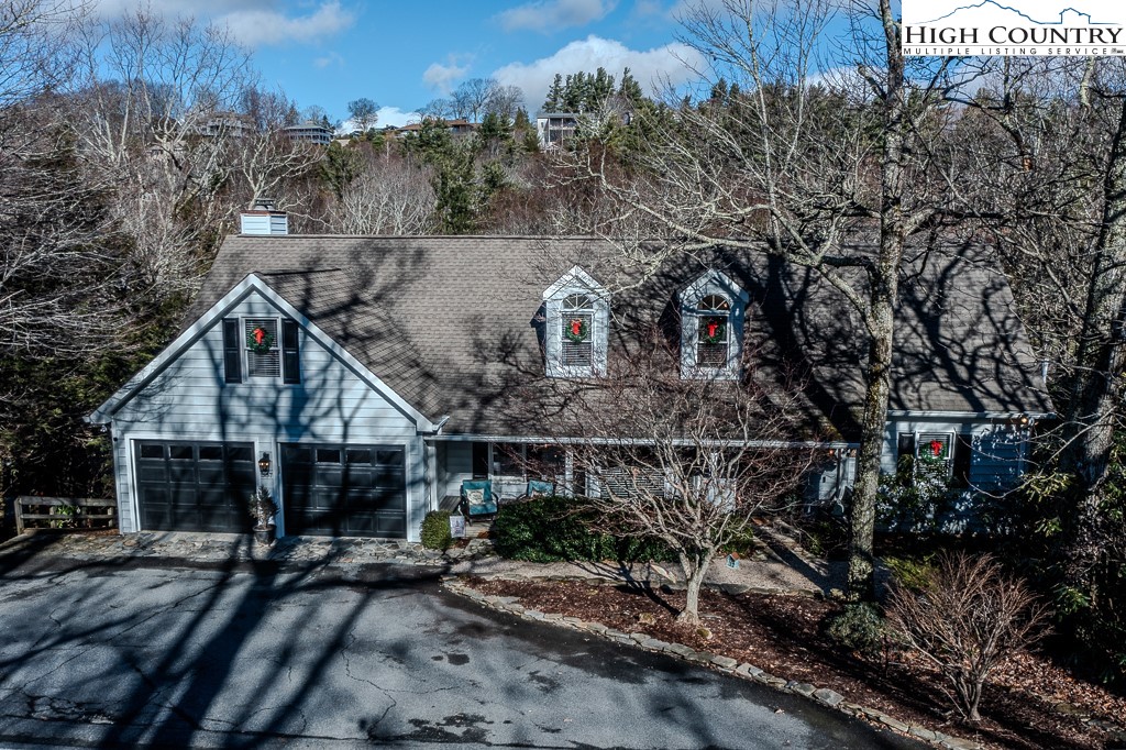 387 Tarry Acres Circle Blowing Rock, NC 28605 - Photo 39 of 41 a view of a house with a yard and hanging chair