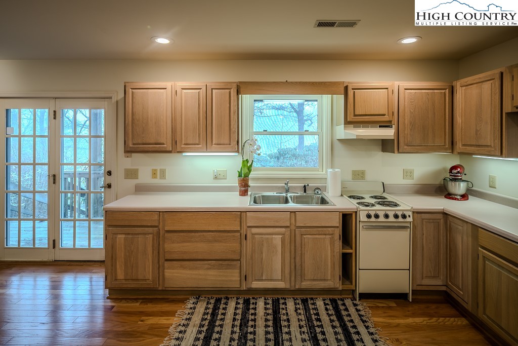 387 Tarry Acres Circle Blowing Rock, NC 28605 - Photo 41 of 41 a kitchen with a sink window and cabinets