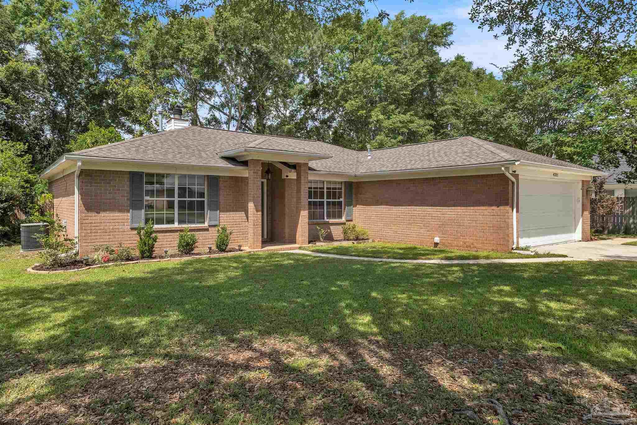 4321 Ridgeland Drive Pace, FL 32571 - Photo 25 of 36 a view of a house with a yard