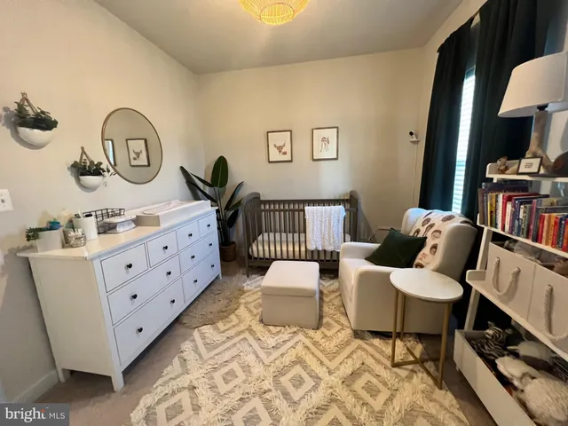 a bedroom with furniture and a wooden floor