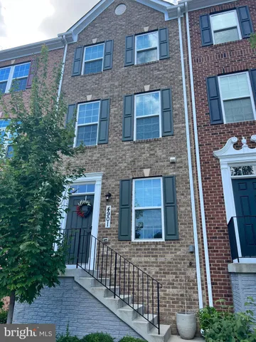 a brick building with a bench in front of it