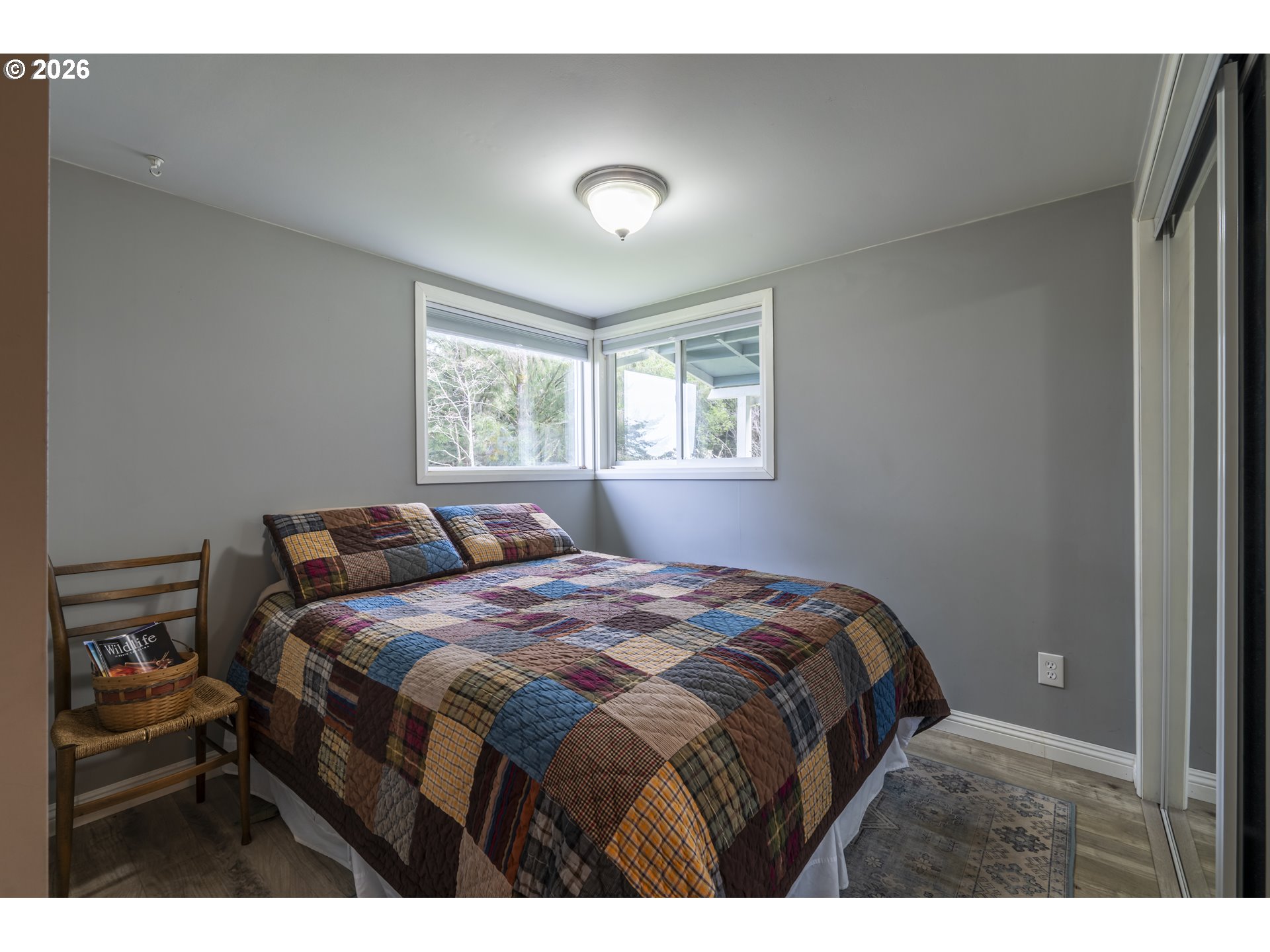 42528 Hensley Hill Road Port Orford, OR 97465 - Photo 12 of 37 a bedroom with a bed and a window