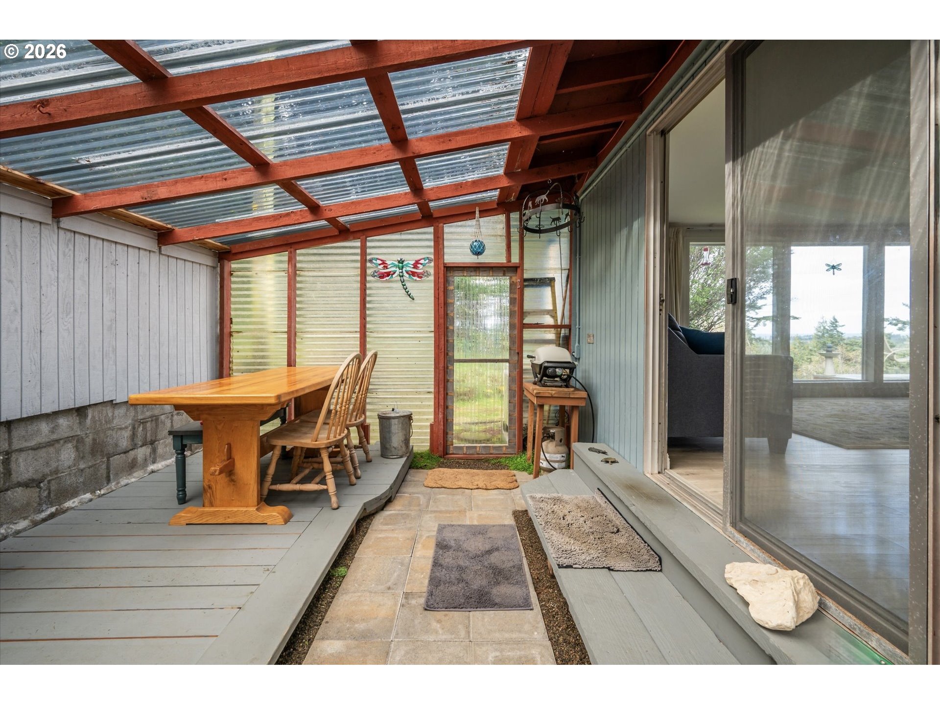 42528 Hensley Hill Road Port Orford, OR 97465 - Photo 20 of 37 a view of a room with wooden floor and windows
