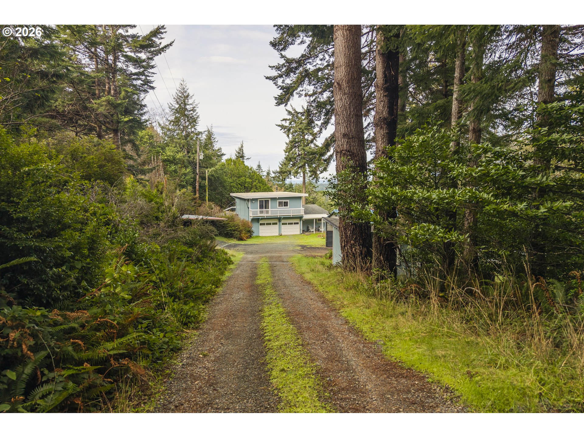 42528 Hensley Hill Road Port Orford, OR 97465 - Photo 23 of 37 a swimming pool with trees in the background