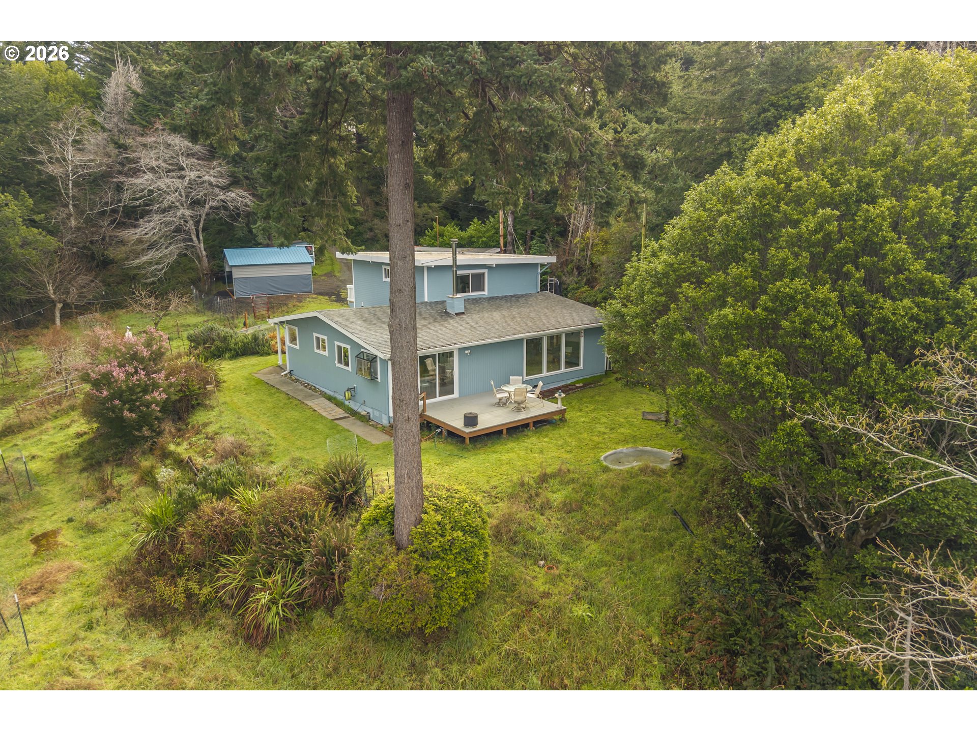 42528 Hensley Hill Road Port Orford, OR 97465 - Photo 24 of 37 a view of a house with a big yard