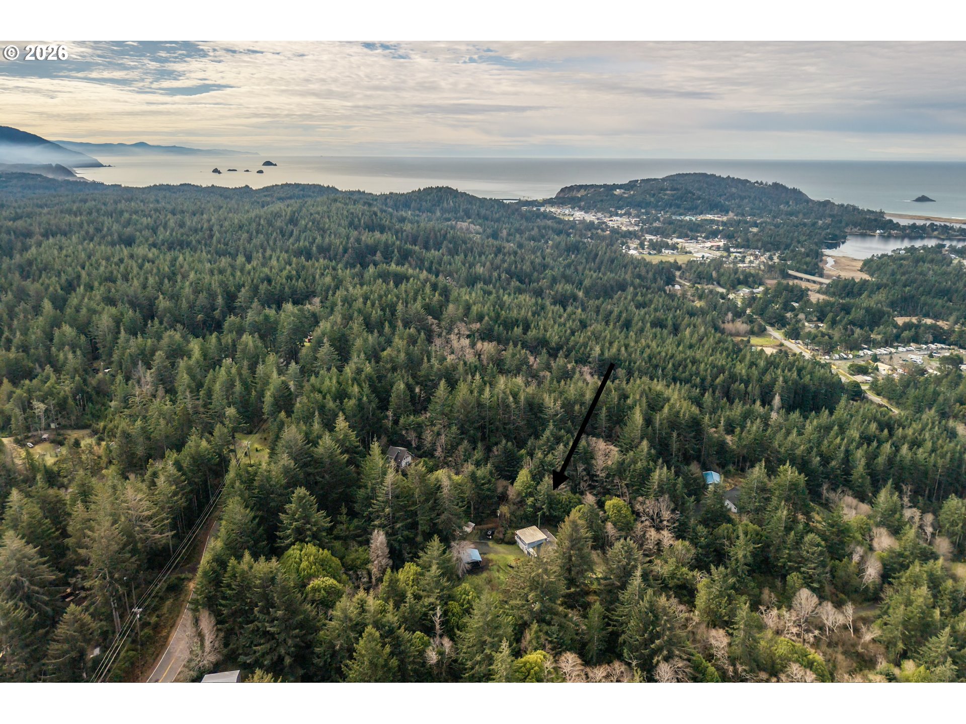 42528 Hensley Hill Road Port Orford, OR 97465 - Photo 27 of 37 a view of an ocean and a mountain