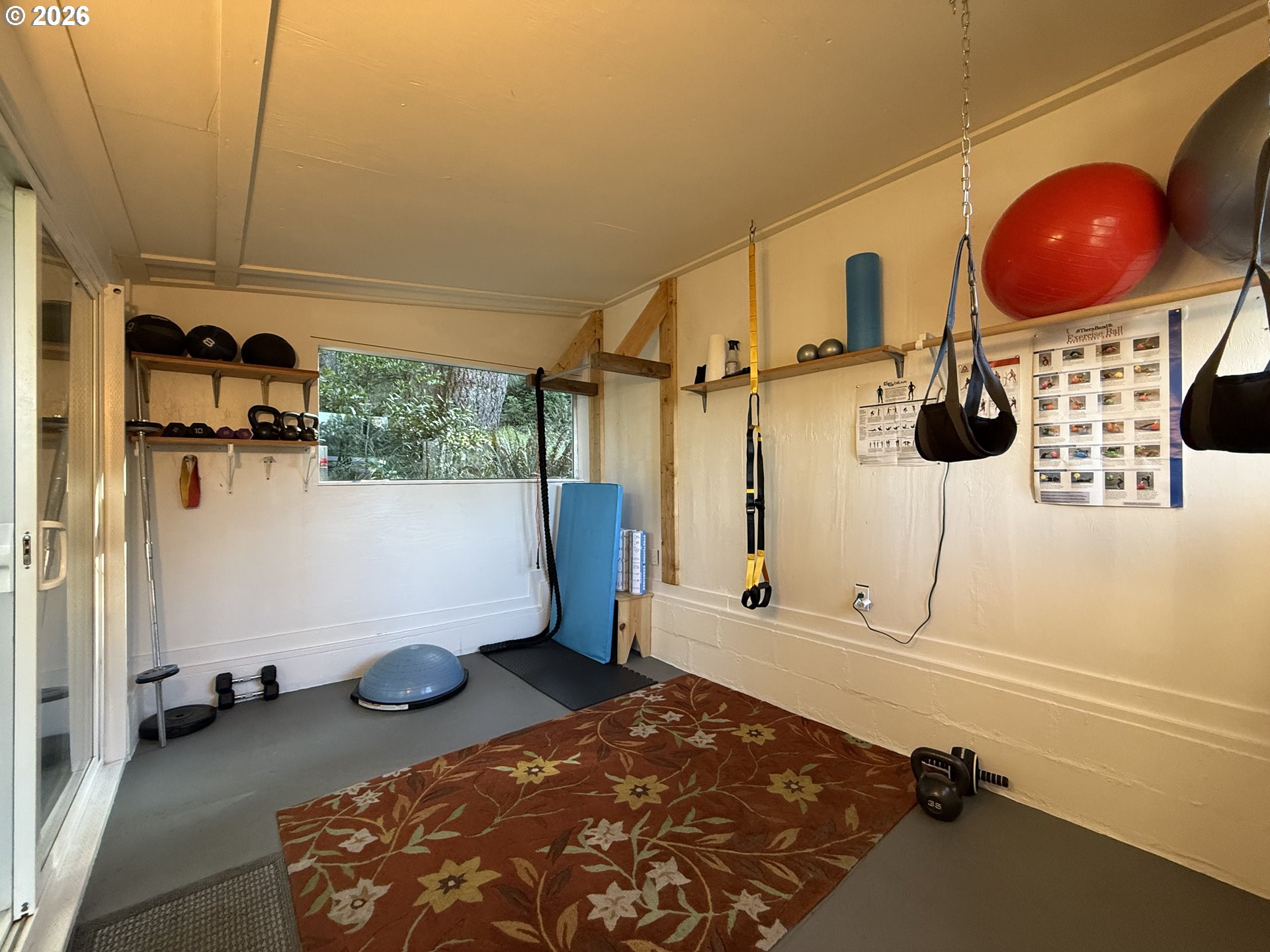 42528 Hensley Hill Road Port Orford, OR 97465 - Photo 32 of 37 a bedroom with a bed and cabinets