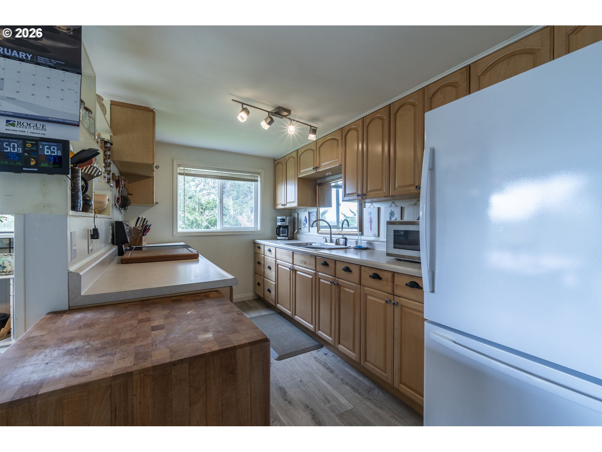 42528 Hensley Hill Road Port Orford, OR 97465 - Photo 7 of 37 a kitchen with sink cabinets and window