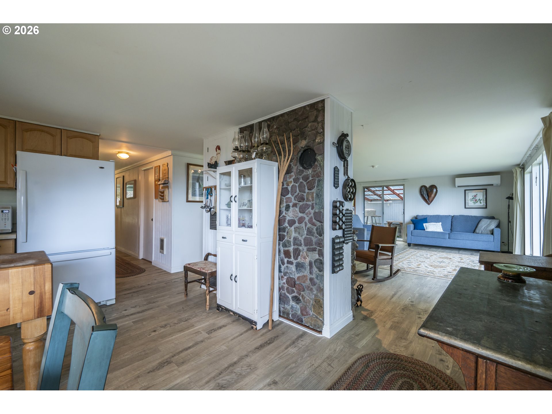 42528 Hensley Hill Road Port Orford, OR 97465 - Photo 10 of 37 a living room with furniture and a wooden floor