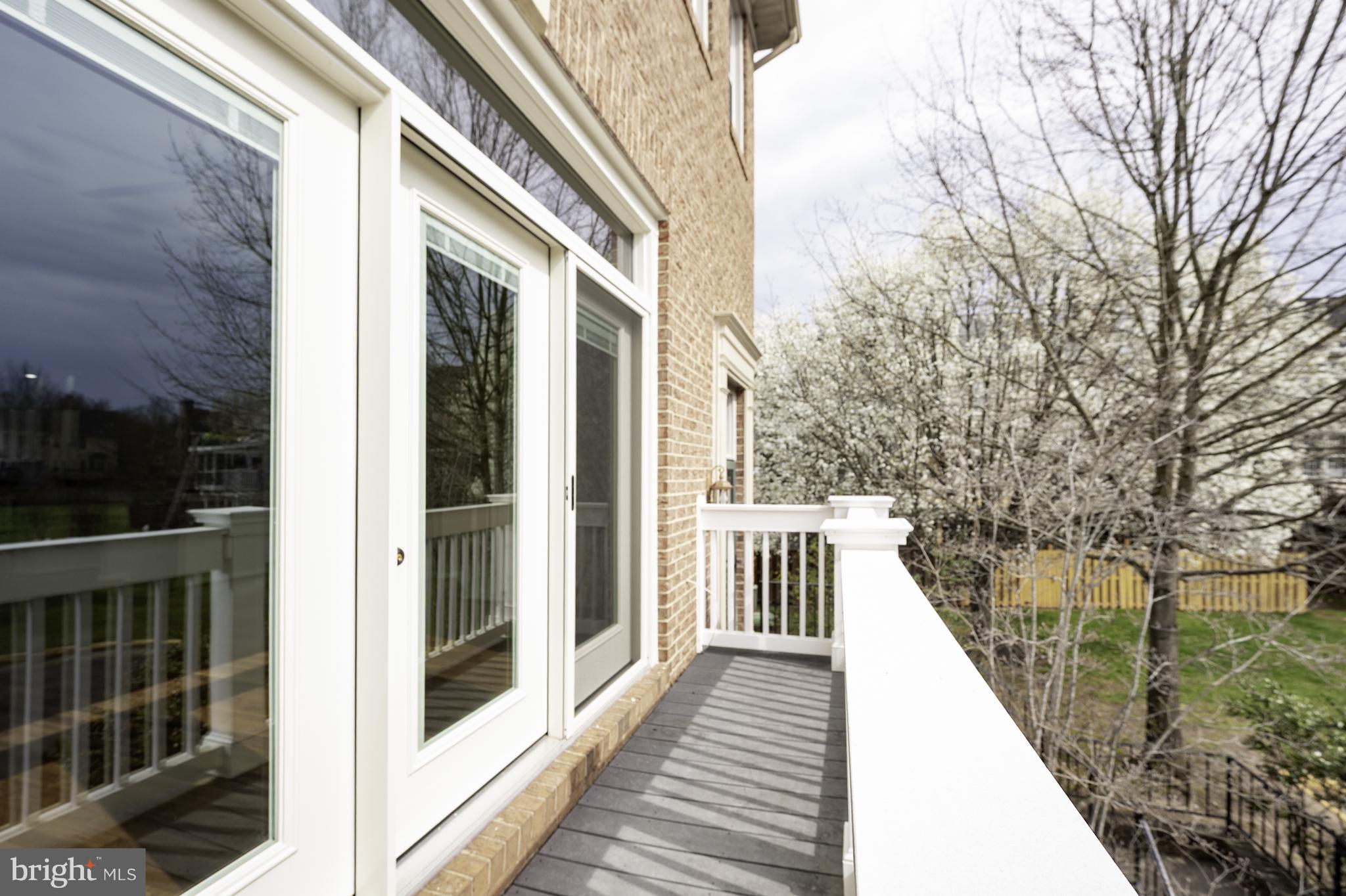 20334 Burnley Square Sterling, VA 20165 - Photo 11 of 57 a view of a balcony with wooden floor and fence