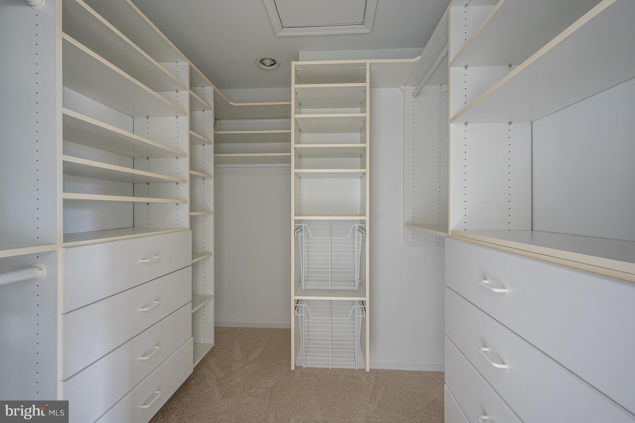 20334 Burnley Square Sterling, VA 20165 - Photo 27 of 57 a view of walk in closet with empty racks