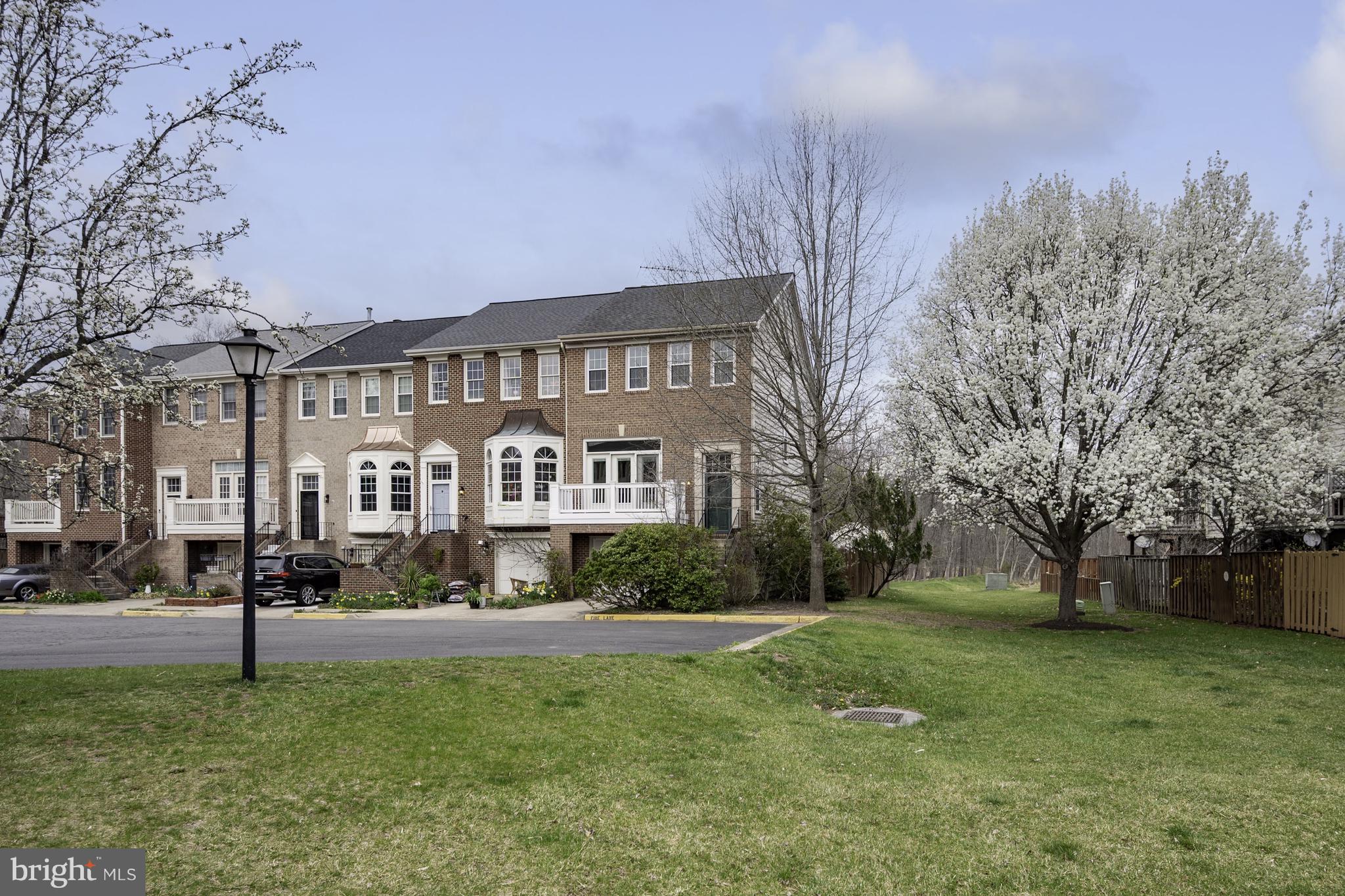 20334 Burnley Square Sterling, VA 20165 - Photo 3 of 57 a front view of a building with garden