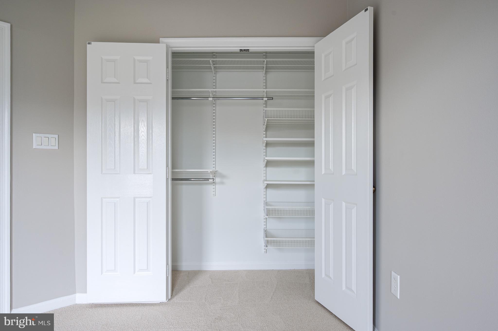 20334 Burnley Square Sterling, VA 20165 - Photo 32 of 57 a view of walk in closet with empty racks