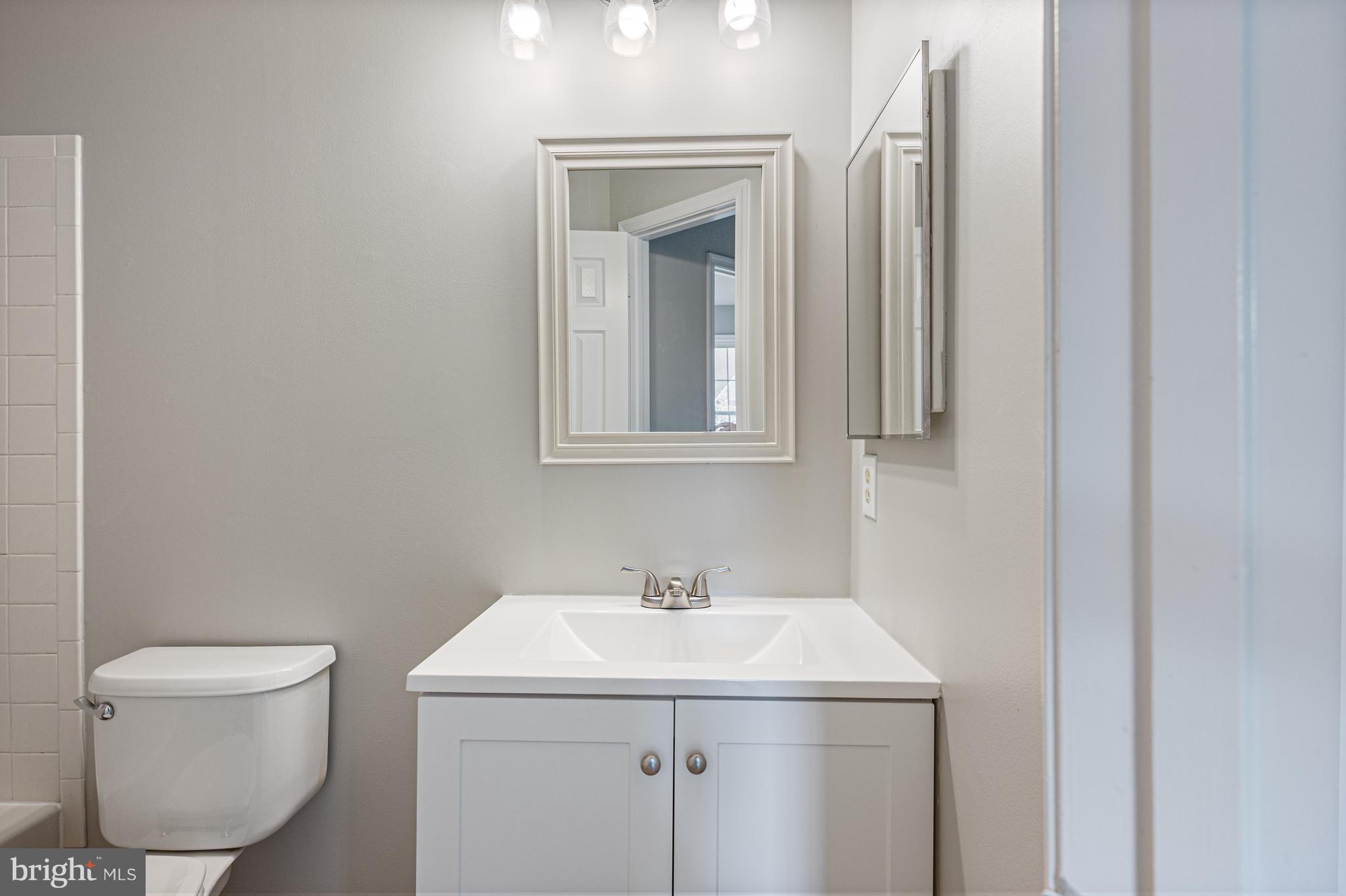 20334 Burnley Square Sterling, VA 20165 - Photo 34 of 57 a bathroom with a sink and a toilet