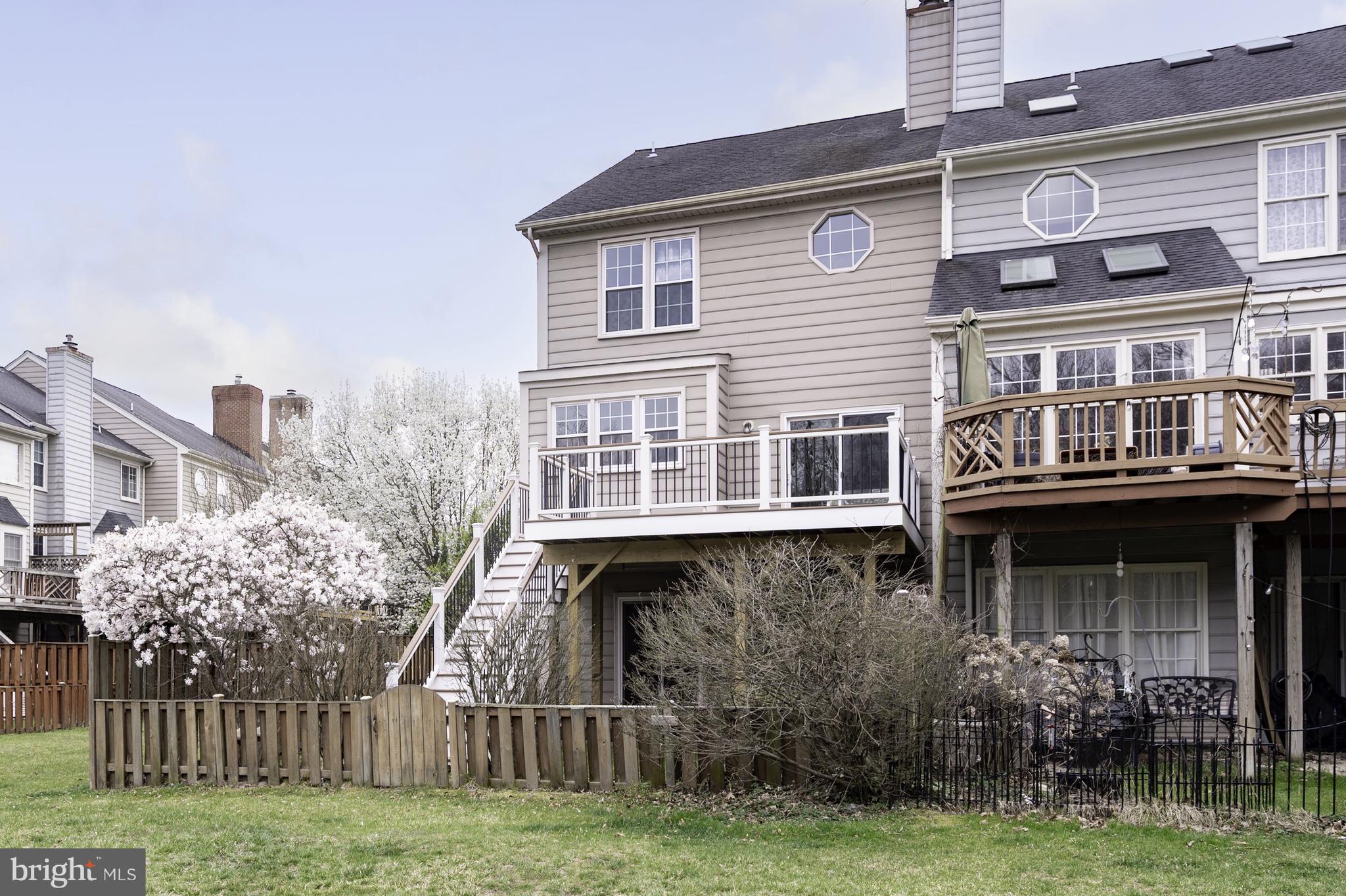 20334 Burnley Square Sterling, VA 20165 - Photo 48 of 57 a front view of a house with a yard