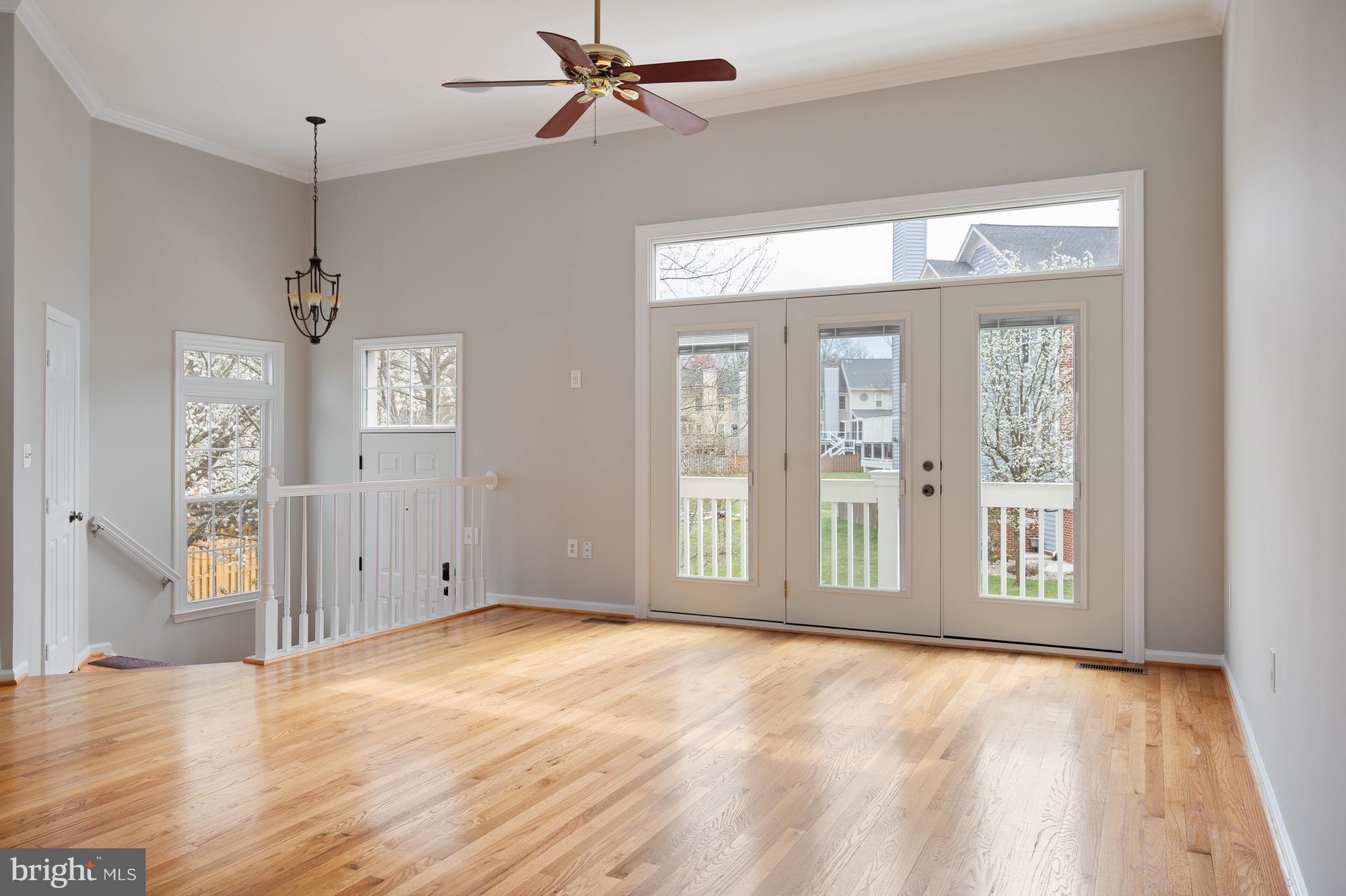 20334 Burnley Square Sterling, VA 20165 - Photo 7 of 57 a view of an empty room with a window and wooden floor