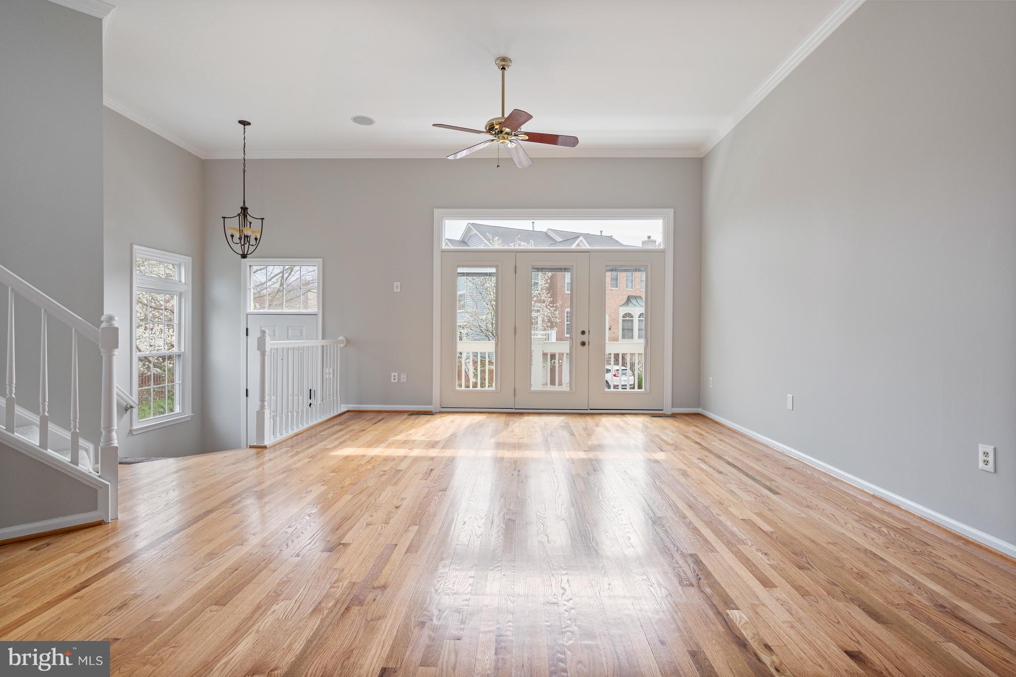 20334 Burnley Square Sterling, VA 20165 - Photo 8 of 57 a view of an empty room with wooden floor and window