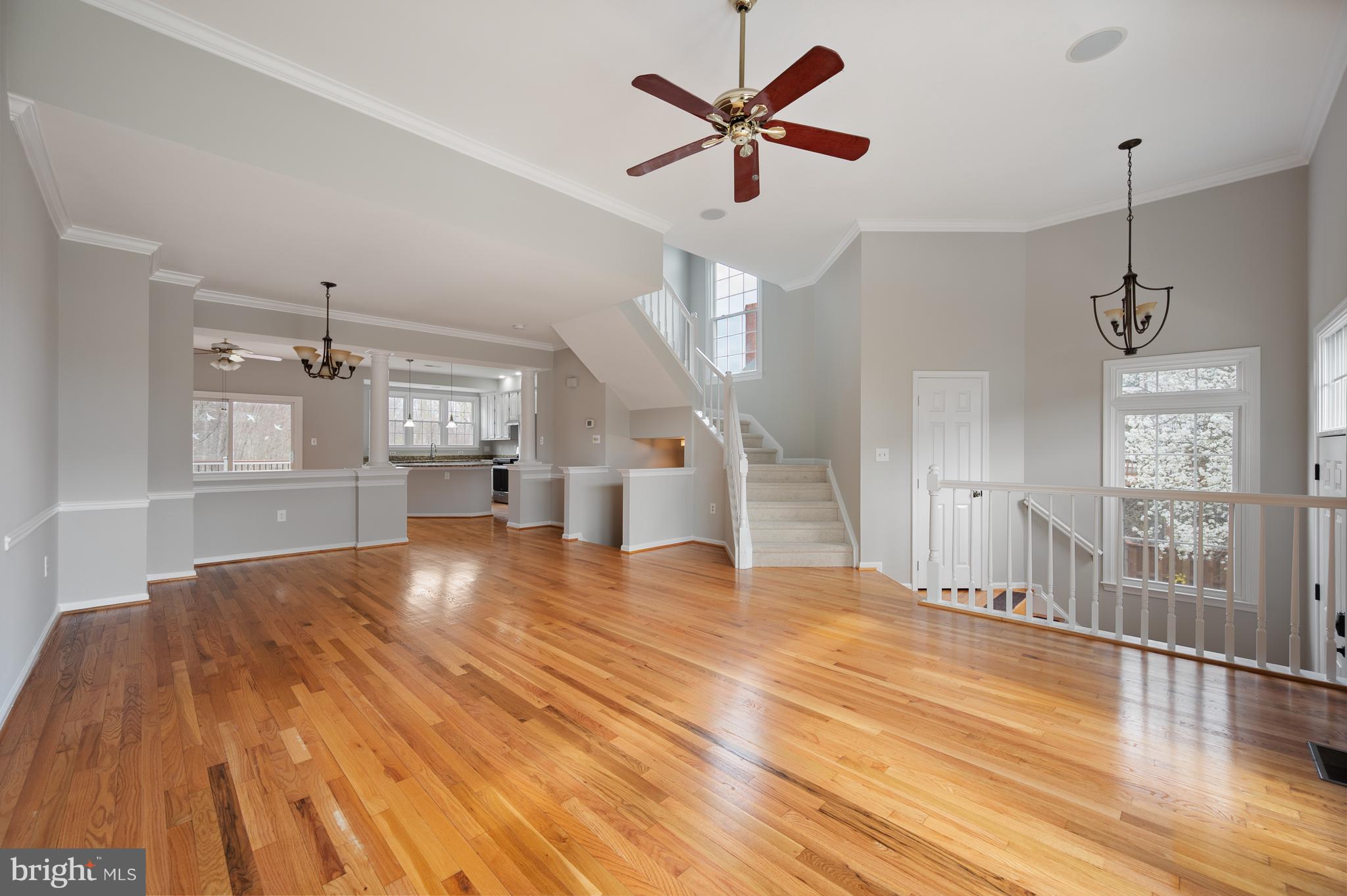 20334 Burnley Square Sterling, VA 20165 - Photo 9 of 57 a view of an empty room with window and wooden floor