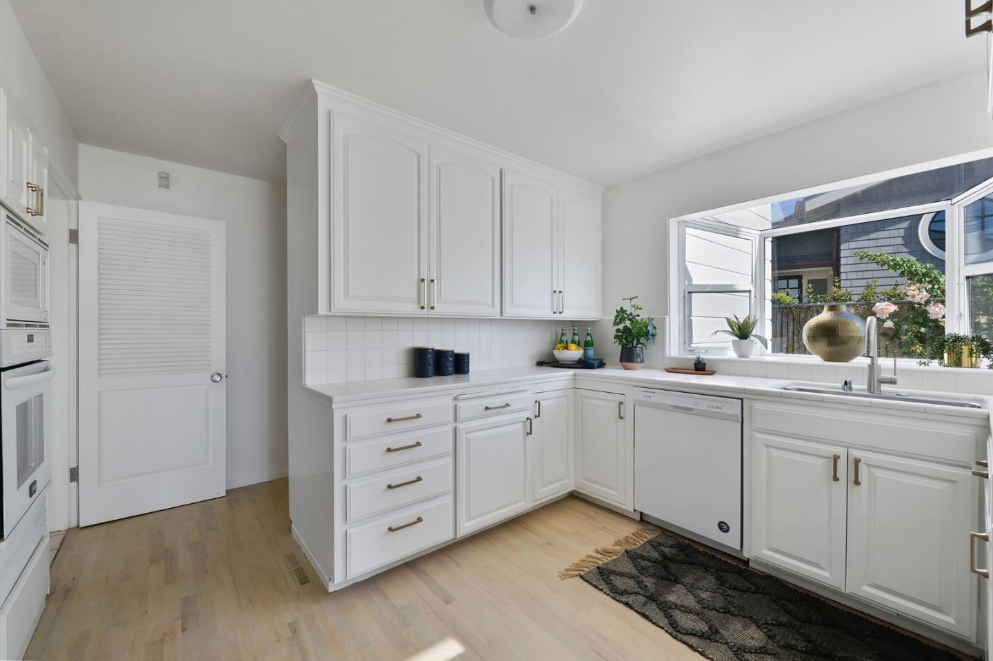 532 Bayview Drive Aptos, CA 95003 - Photo 18 of 47 a kitchen with cabinets appliances and a window