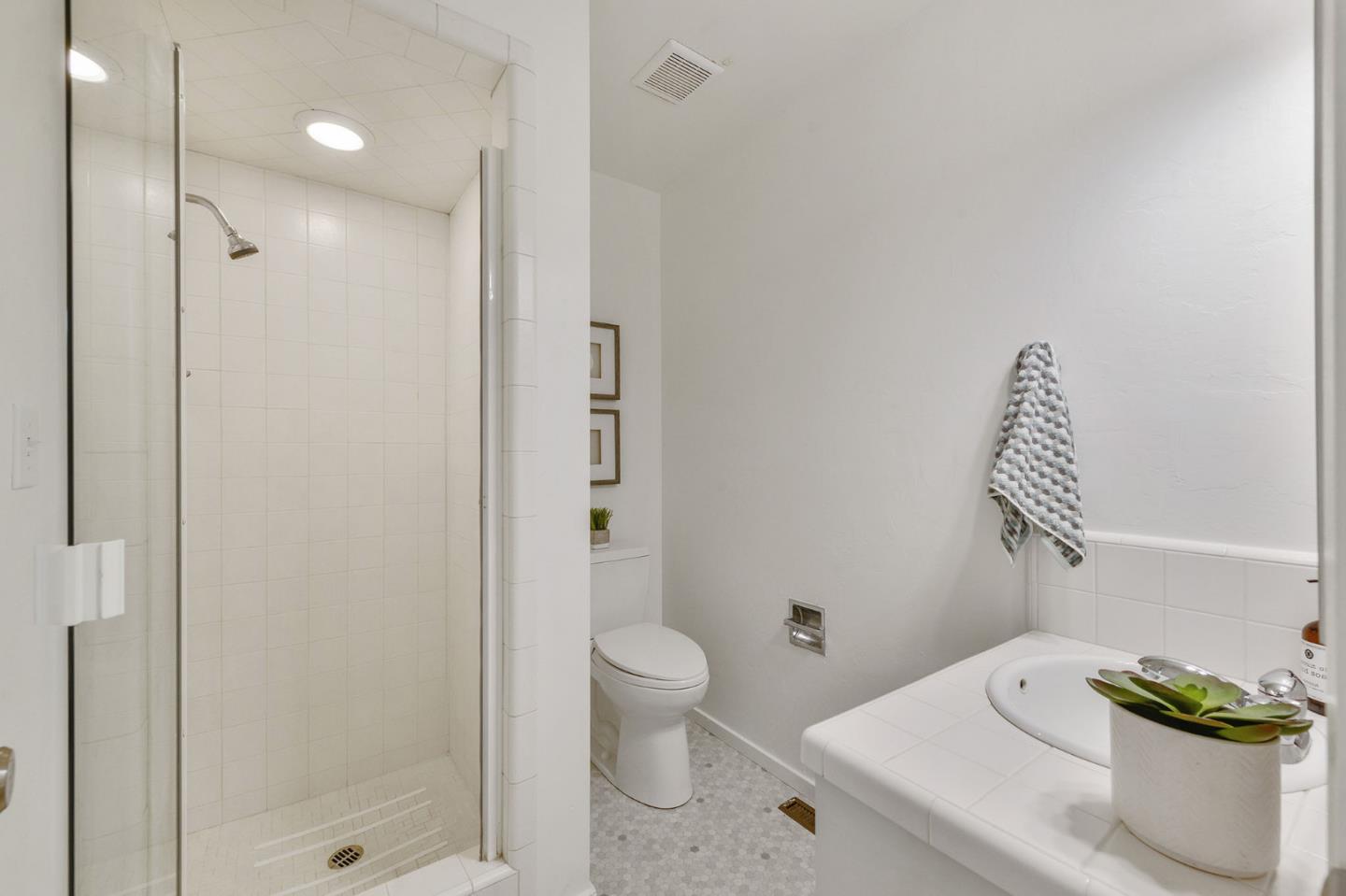 532 Bayview Drive Aptos, CA 95003 - Photo 27 of 47 a bathroom with a shower a toilet and a sink