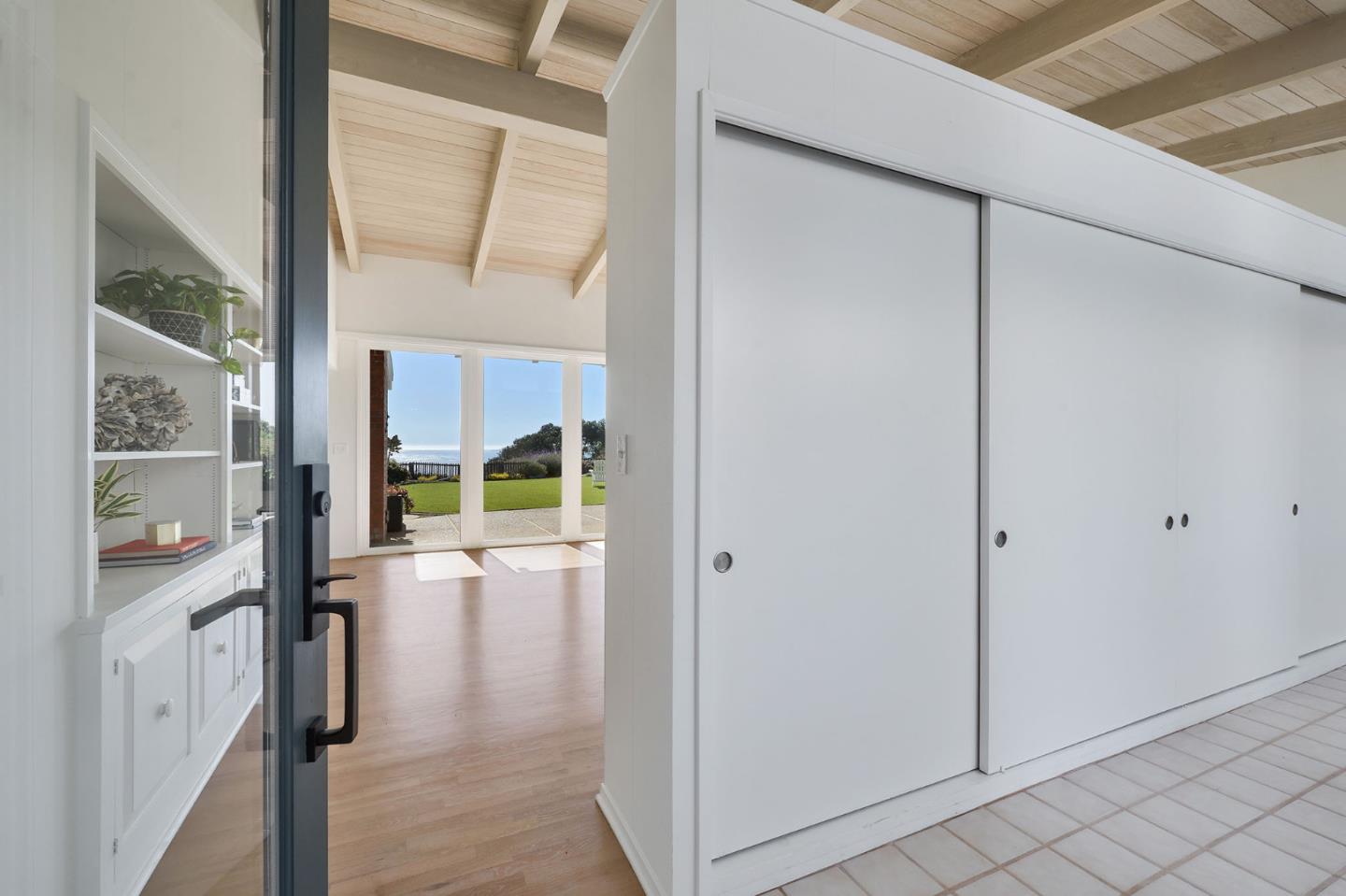 532 Bayview Drive Aptos, CA 95003 - Photo 4 of 47 a view of a hallway with wooden floor and staircase