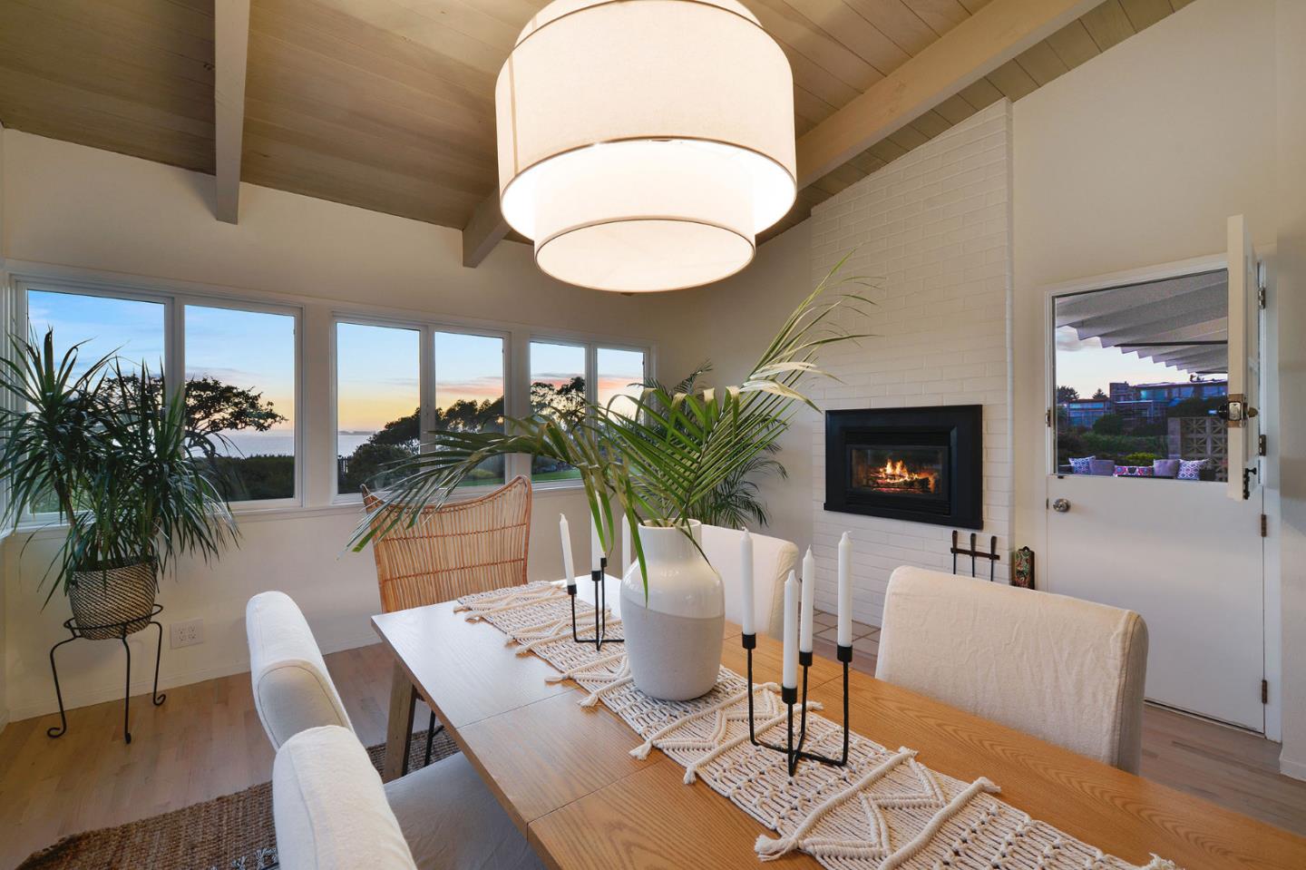 532 Bayview Drive Aptos, CA 95003 - Photo 45 of 47 a dining room with furniture potted plants and wooden floor