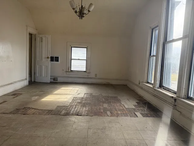 an empty room with windows